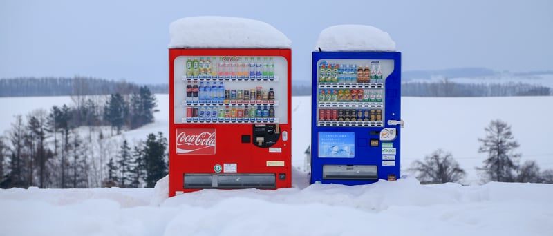 Two vending machines in the snow in Japan