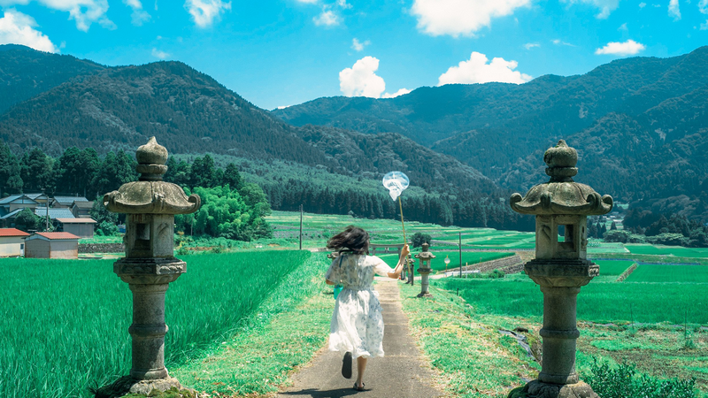 Girl running with net on road in Japan