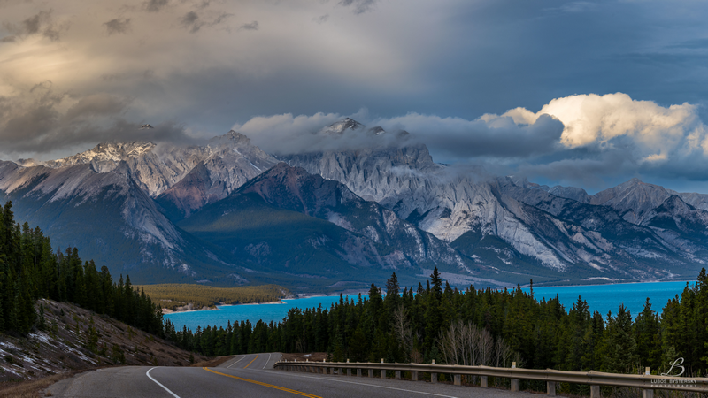Mountain landscape with a road and turquoise lake