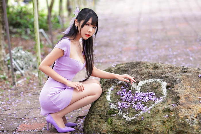 Woman in purple dress with black hair