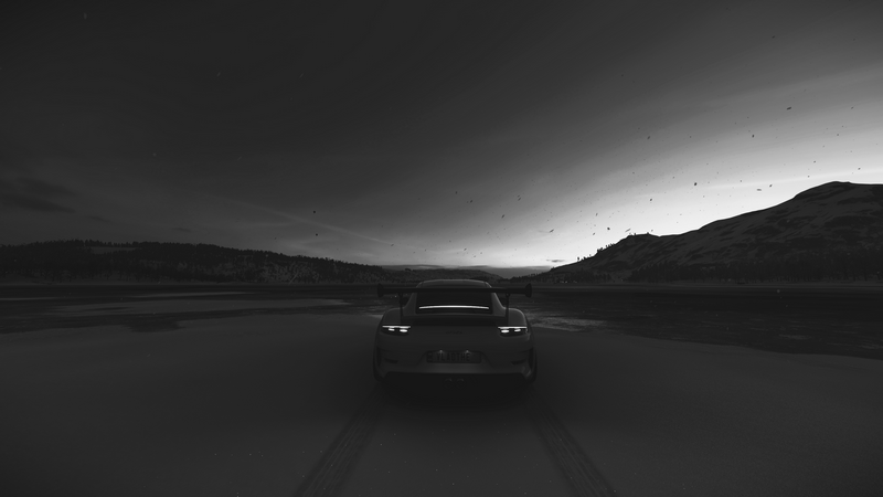 Porsche GT3 RS driving on a dark road