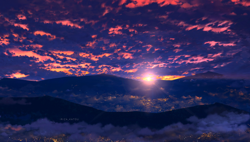 Scenery of mountains at sunset with clouds and city lights