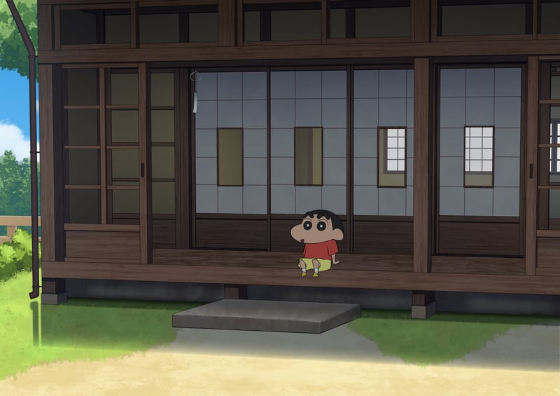 Shinchan sitting on a wooden porch