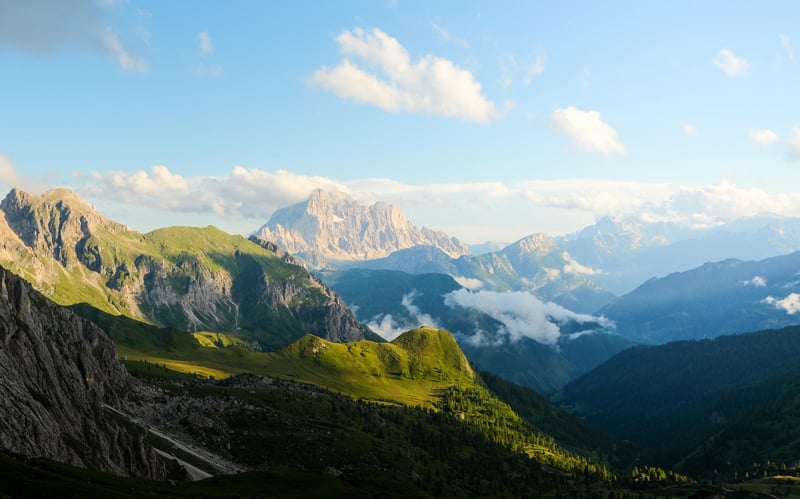 Green Mountains and Valley Under a Cloudy Sky