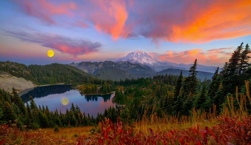 Mountain Lake with Colorful Sunset Clouds and Moon