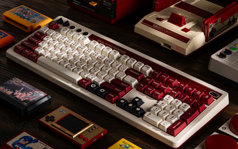 Retro gaming mechanical keyboard with cartridges and consoles