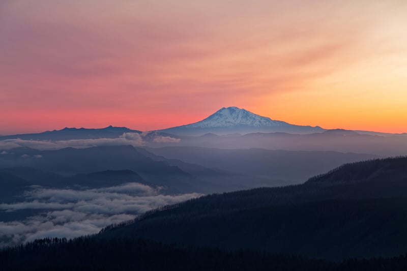 Majestic Mountain Peak at Sunset with Fog