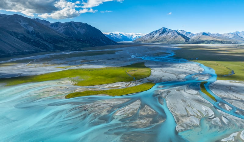 Aerial view of a braided river flowing through a valley