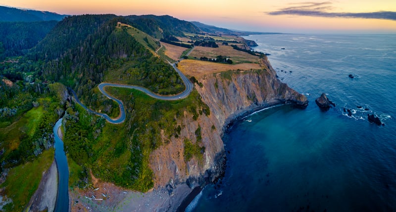 Coastal Highway Winding Along a Cliffside Overlooking the Ocean