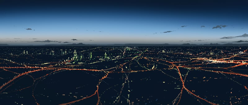 Aerial view of a sprawling city at dusk