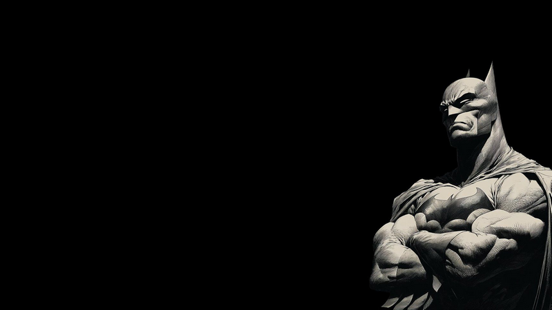 Batman standing with arms crossed in monochrome