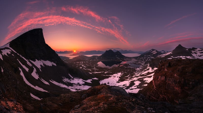 Sunrise over snowy mountains and lakes