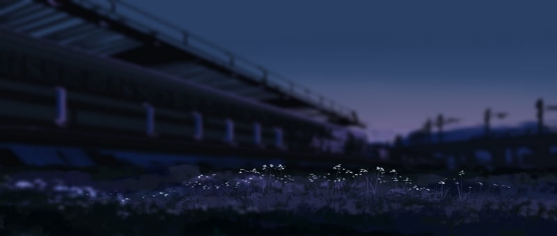 Gracile flowers under a bridge at dusk