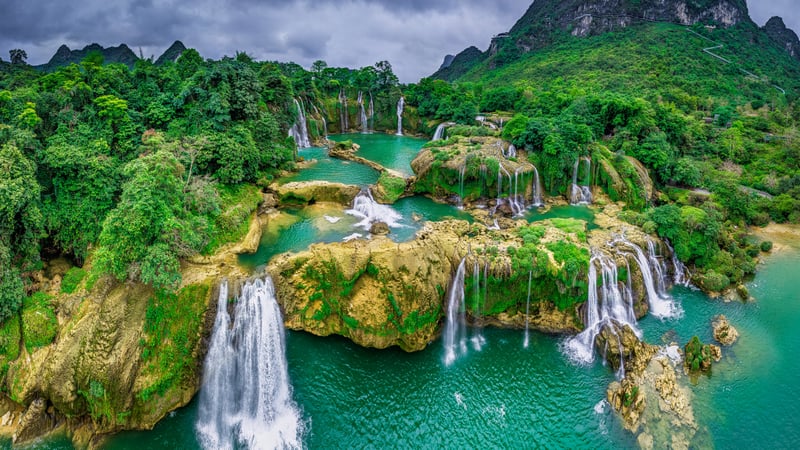 Ban Gioc Waterfall, Vietnam, with green mountains and water
