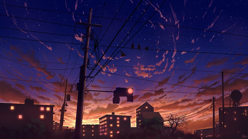 Cityscape at sunset with power lines and buildings