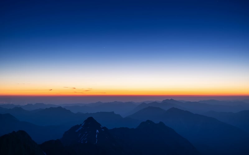 Mountain range at sunset with gradient sky