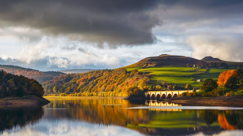 Autumn landscape with a bridge over a reservoir