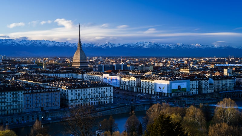 Mole Antonelliana and Alps over Turin cityscape