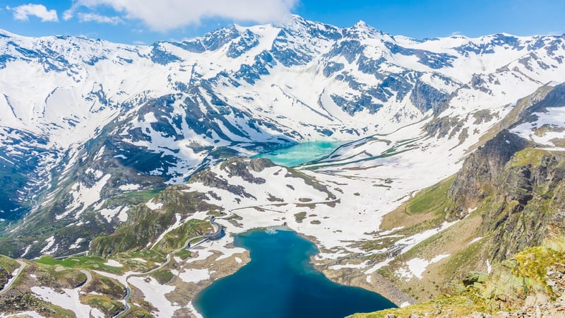 Snowy mountains with turquoise and blue lakes