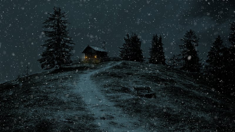 Snowing on a cabin on a hill