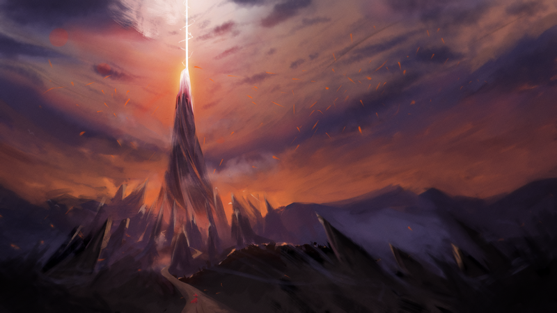 Jagged mountain peak with light beam at sunset