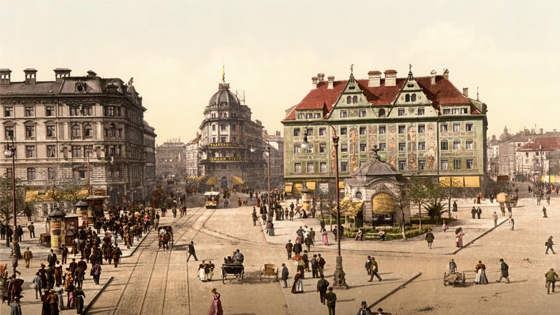 Munich town square with trams and crowds