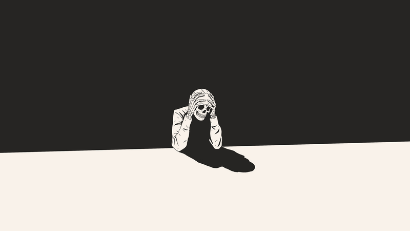 Skeleton holding head in despair