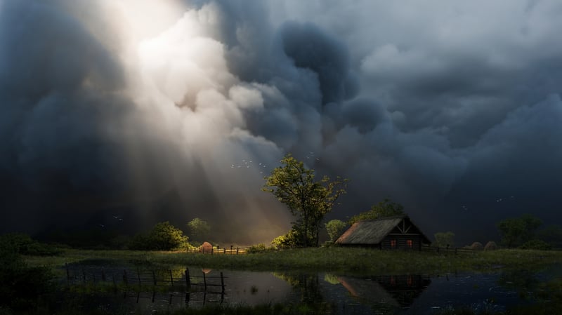 Stormy clouds with sunbeams over a rural landscape