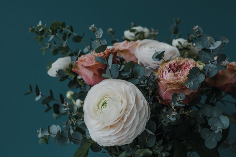Close-up of a bouquet of roses and eucalyptus
