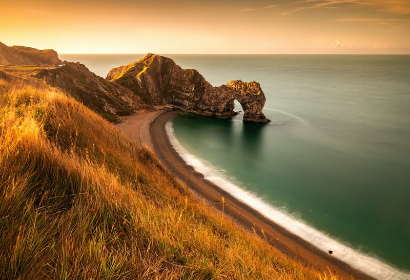 Durdle Door rock arch at sunset on the Jurassic Coast