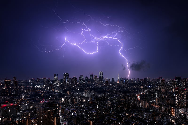 Lightning strikes over Tokyo cityscape at night