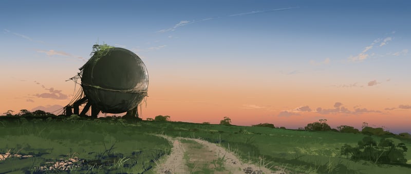Abandoned spherical structure in a grassy field at sunset