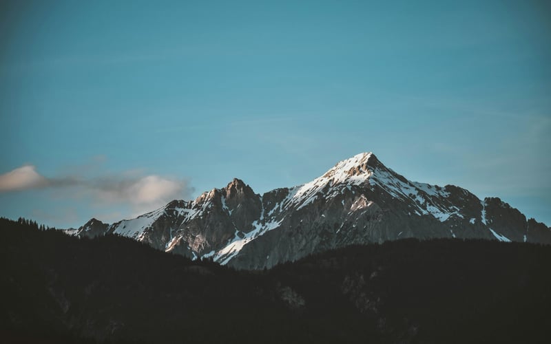 Snowy mountain peaks under a clear blue sky