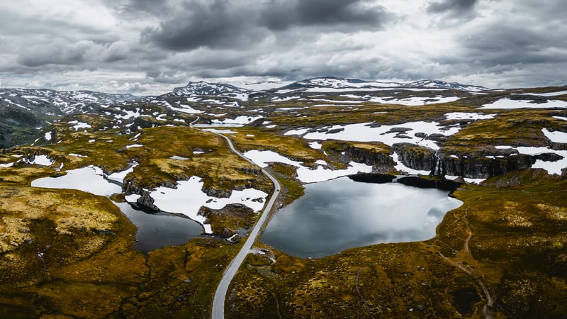 Mountain landscape with lakes and snow patches