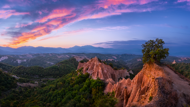 Melnik Earth Pyramids at sunset with colorful clouds