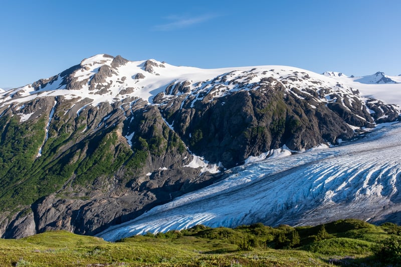 Snow-capped mountain with a glacier in Alaska, USA