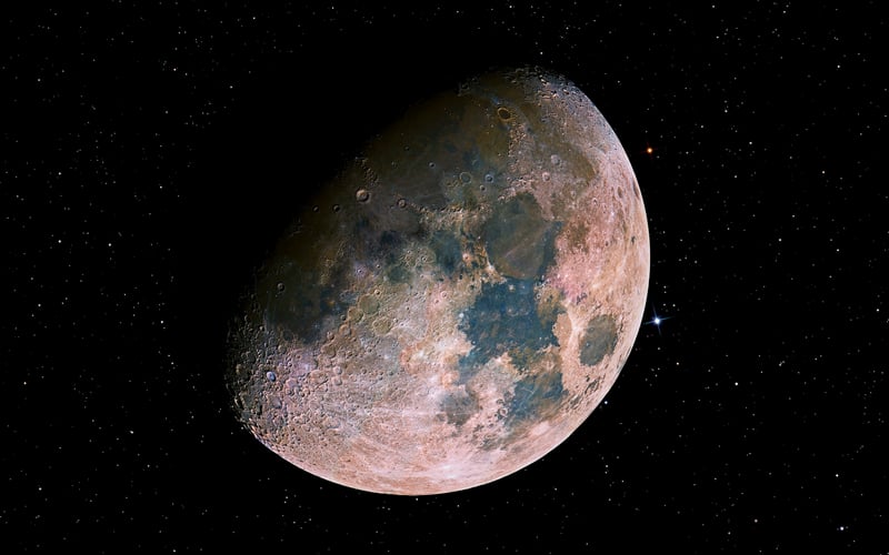 The Moon with colorful surface details in space