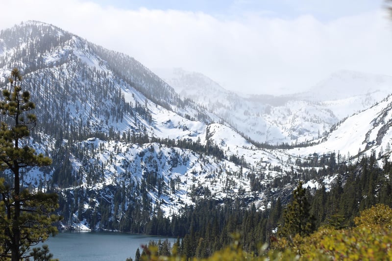 Snow-covered mountains overlooking a lake in California