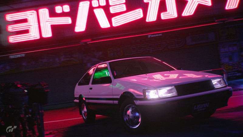 Toyota AE86 in front of neon Japanese sign