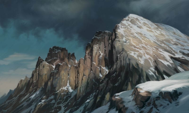 Scenery of snow-capped mountains under a cloudy sky