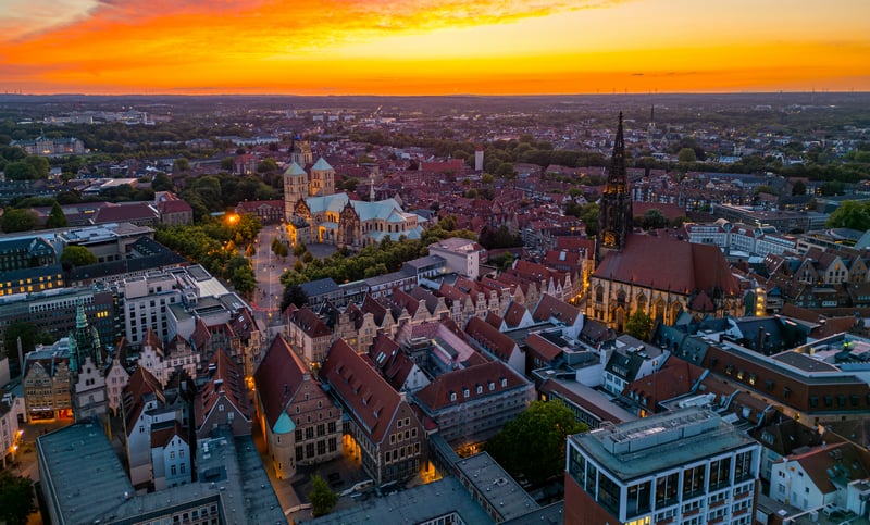 Aerial view of a European city at sunset