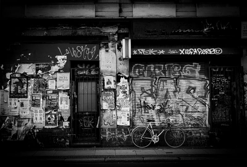 Graffiti-covered storefront with a bicycle
