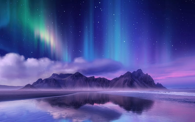 Aurora Borealis over mountains and reflection