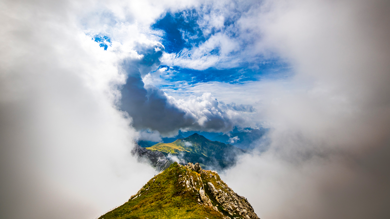 Clouds over Monte Pora mountains in Dolomites