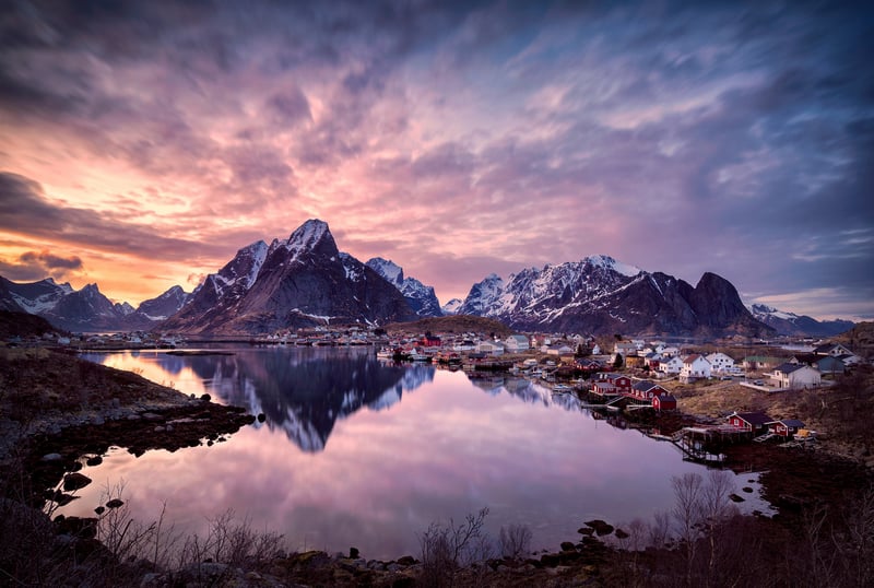 Snowy Mountains Reflecting in a Lake at Sunset