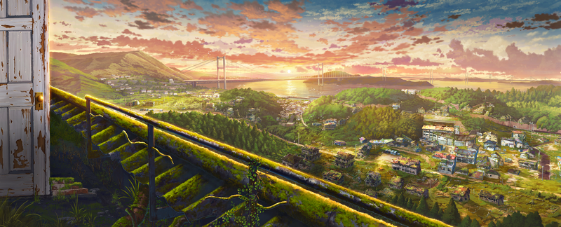 Sunset over a coastal town with a bridge