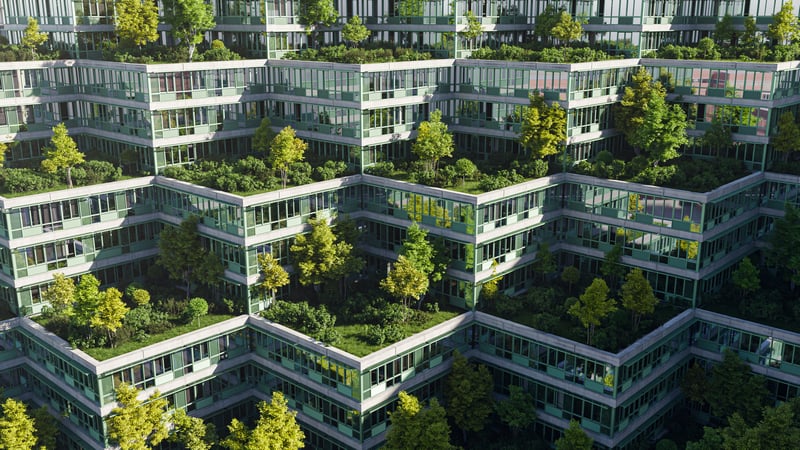 Terraced building with green roofs and trees