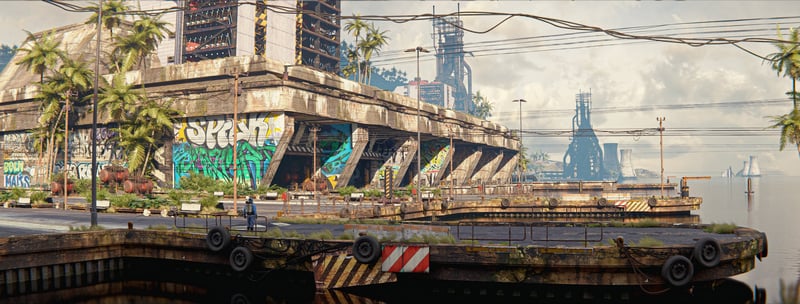 Tires on a waterfront structure with graffiti and industrial background