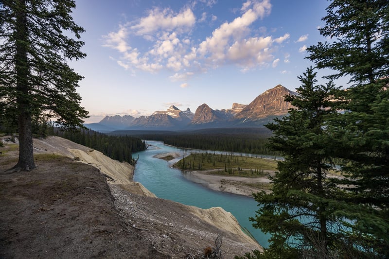 Turquoise River Flows Through Mountains and Forest in Canada