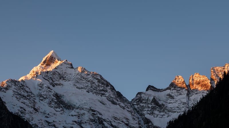 Snowy peaks of Meri Snow Mountain illuminated by sunlight